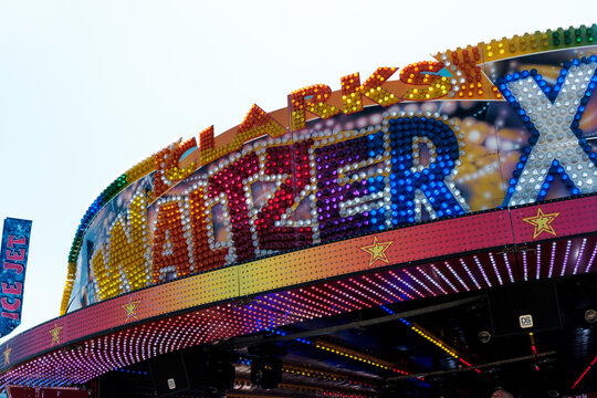Newcastle UK: 26th June 2024: Newcastle Hoppings funfair waltzer sign on sunny day