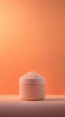 Minimalist jar of collagen powder with soft glow against orange background, showcasing its smooth texture and natural color. Perfect for health and beauty enthusiasts