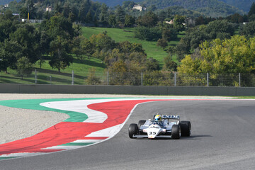 Fototapeta premium Scarperia, Italy - October 12th 2024: Osella FA1/B of year 1981 ex Jean Pierre Jarier drive by unknown in action during practice session at Mugello Circuit.