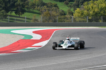 Fototapeta premium Scarperia, Italy - October 12th 2024: Williams FW07C of year 1981 ex Alan Jones drive by unknown in action during practice session at Mugello Circuit.