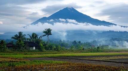 Fototapeta premium East Java volcano towering over the landscape, with clouds of volcanic gas and sulfur deposits