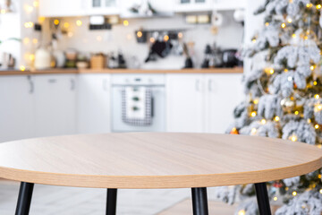 Round empty table to demonstrate the product with space for text in white kitchen, modern interior...