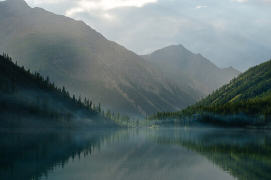 Lake Shavlinskoye on a summer evening in the fog
