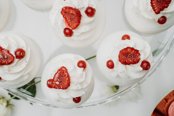 Elegant cheesecake squares displayed on a golden cake stand. The soft, creamy layers and delicate decorations make these treats perfect for weddings, celebrations, and upscale events.

