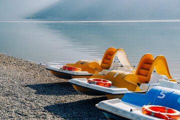water catamarans on the beach of the resort town near the sea for tourists. Resort water transport....