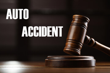 Auto accident law. Wooden judge's gavel on table