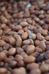 A heap of roasted peeled peanut on a street foodcart, Fresh roasted peanuts selling by a street vendor, A bunch of peeled peanuts.
