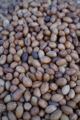 A heap of roasted peeled peanut on a street foodcart, Fresh roasted peanuts selling by a street vendor, A bunch of peeled peanuts.