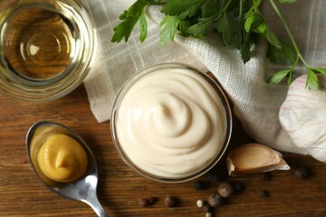 Bowl with mayonnaise and ingredients for cooking on the table 