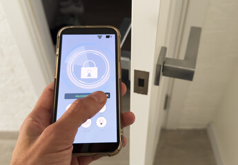 Smart house, home automation, device with App icons. Man uses his smartphone with smarthome app to control the lights of his house.