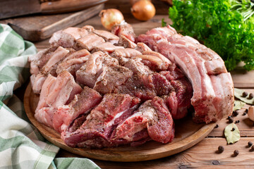 Raw Organic Pork Belly Meat with Salt and Pepper n rustic wooden table