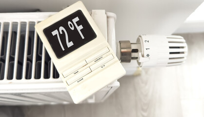 White heating battery and electronic, smart temperature regulator. warmth in the room and the house. preparation for spring and winter. energy saving