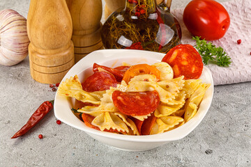 Italian pasta farfalle with pepperoni