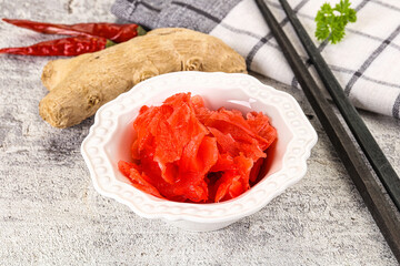 Marinated ginger root in the bowl