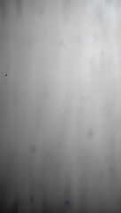 Grungy textured blank surface abstract grey background. Dirty poster wallpaper with rough grained stone pattern and vignette darkened edges, Diffused lighting