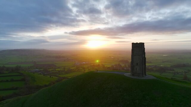 Sunrise over Glastonbury Tor from a drone at autumn, Glastonbury, Somerset, England