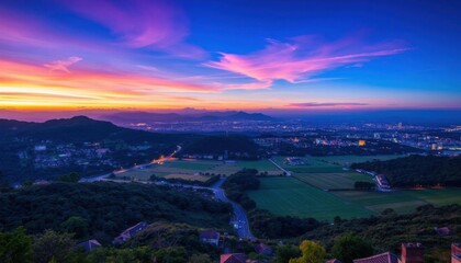 Fototapeta premium a view of a city from a hill at sunset beautiful and spectacular dusk