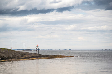A single, small lighthouse on the Norwegian coast, near Haugesund, on a spring day