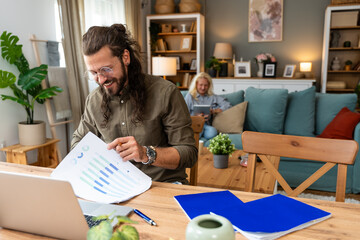 Career winner mindset. Young freelance businessman working at home. Confident dedicated male learning and educate himself for better opportunity in his business career, work online on laptop computer.