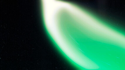 Dark green grainy texture background. Abstract vibrant color wave shape for header or banner promo. Black backdrop. Noisy wide banner header design for social media and website.