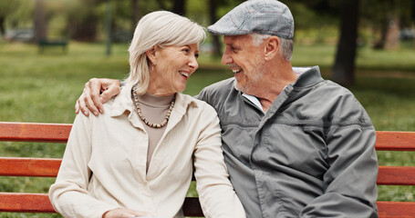 Mature couple, hug and love in park for bonding, conversation and commitment together outdoors. Retirement, marriage and elderly man and women in nature on bench for smile, care and connection