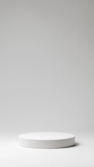 Minimalist white pedestal on gray background, ideal for product presentation and creative displays.
