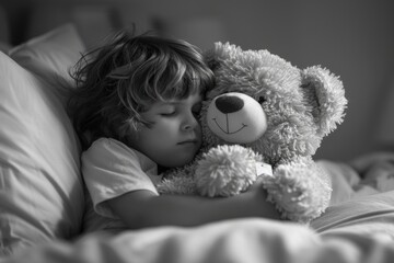 Little boy sleeping bear on a bed, national hug day