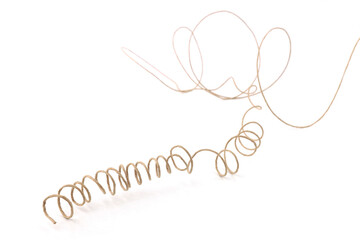 Abstract line of paper covered craft wire isolated on white background. Tangled paper string with...