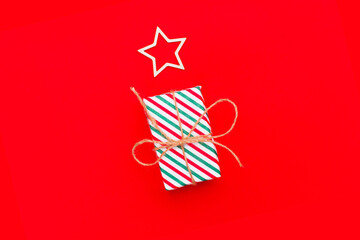 Obraz premium Chrismas gift boxes collection different sizes, mock up template design on red background. Minimal New Year holiday celebration eco package present. Flat lay, fron view