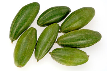 Seven Striped pear gourds Parwal on white background