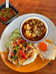Rice topped with stir-fried pork and basil, Rice topped with stir fried minced pork and basil with Fried egg