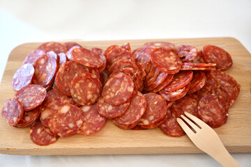 Cutting board Italian salami on white background