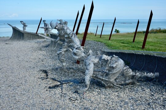 Statues of WW2 soldiers made from individually welded metal washers at The D-Day 75 Garden. Arromanches-les-Bains, France, July 2023. 
