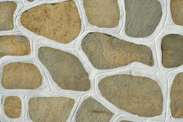The surface of the stone floor with white seams Traditional cobblestone white painted pattern pavement © Tamara