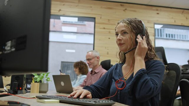 Customer service representative working on computer - business concept