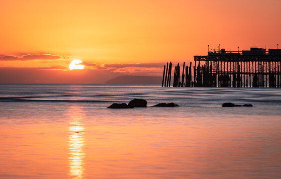 Sunset at low tide on Hastings seafront east Sussex south east England UK