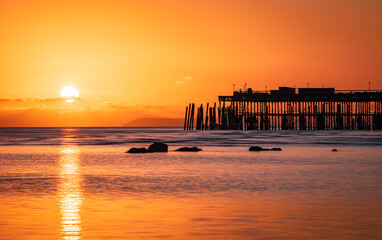 Sunset at low tide on Hastings seafront east Sussex south east England UK