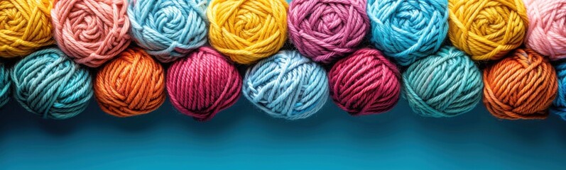 A close up of a row of multicolored yarn balls, crocheting hobby, banner, copy space