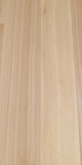 Closeup of light wooden floor with natural grain patterns and smooth finish, smooth