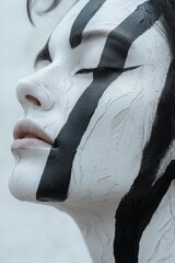 Woman with painted face, creative portrait