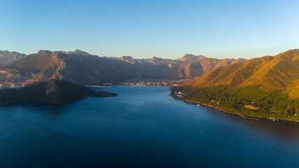 Fototapeta premium Drone aerial view of Marmaris and the mountains around during sunrise