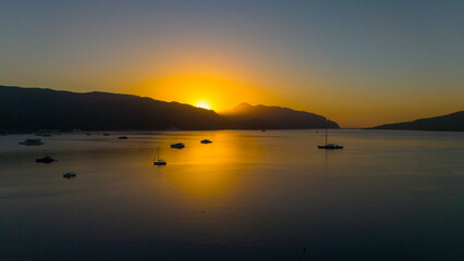 Drone aerial view of Marmaris and the mountains around during sunrise