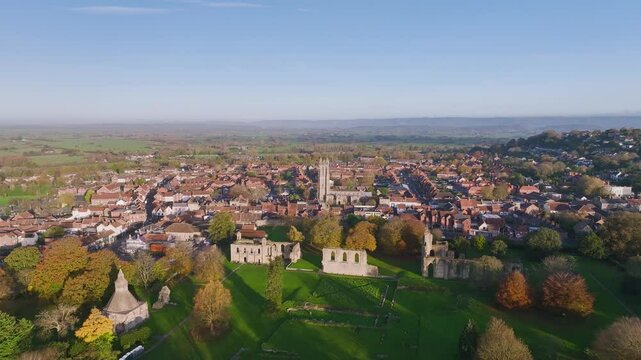 Sunrise over Glastonbury Abbey from a drone, Glastonbury, Somerset, England