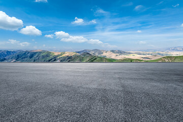 Empty asphalt road and mountains background