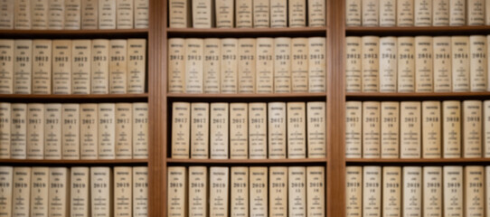 Blurred view of customer books on bookshelves