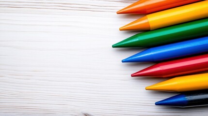 Fototapeta premium Colorful Crayons on White Wooden Background