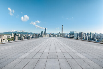 Naklejka premium Empty floor square and cityscape with skyline in modern city