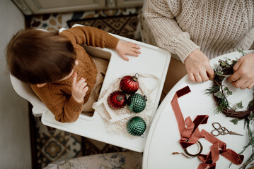 Grandmother and grandson make Christmas decorations. Ecological and vintage hand-made decor. Top view