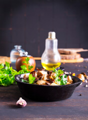 meat stew with mushrooms in cream sauce in pan