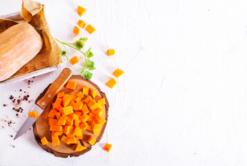 raw pumpkin cubes on board